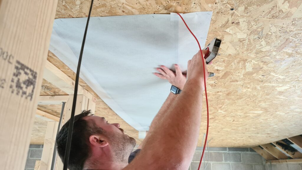 Heating being installed behind plasterboard