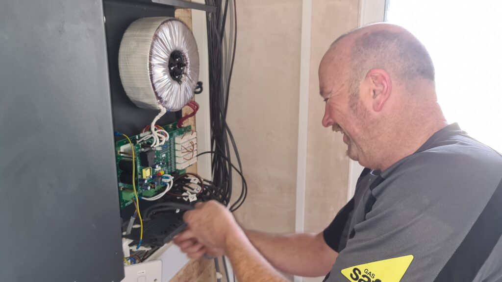 electrician installing a 36v transformer